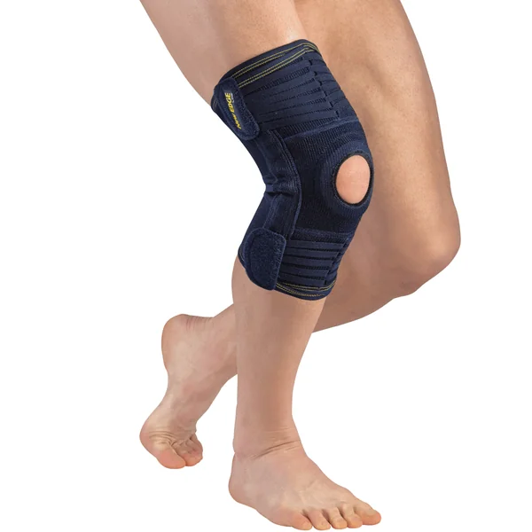 Genouillère ligamentaire réglable évolutive à fenêtre rotulienne